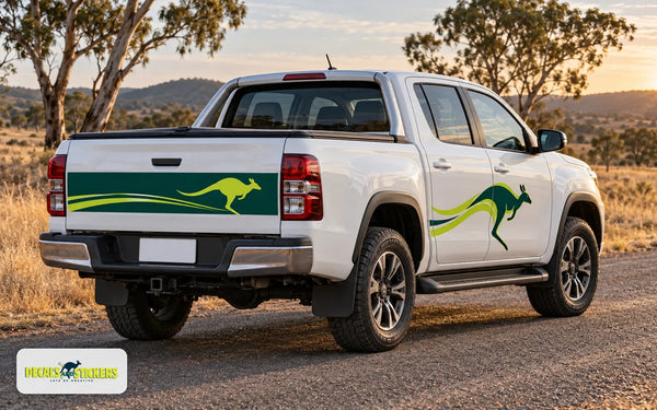 White dual cab ute on a country road with a kangaroo decal on the rear door and a long decal across the tailgate, windows and number plate left clear